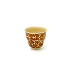 Angled front view of the 50ml Glazara Gilded Blossom teacup, highlighting its crafted inner rim and un-glazed interior perfect for tea tasting.