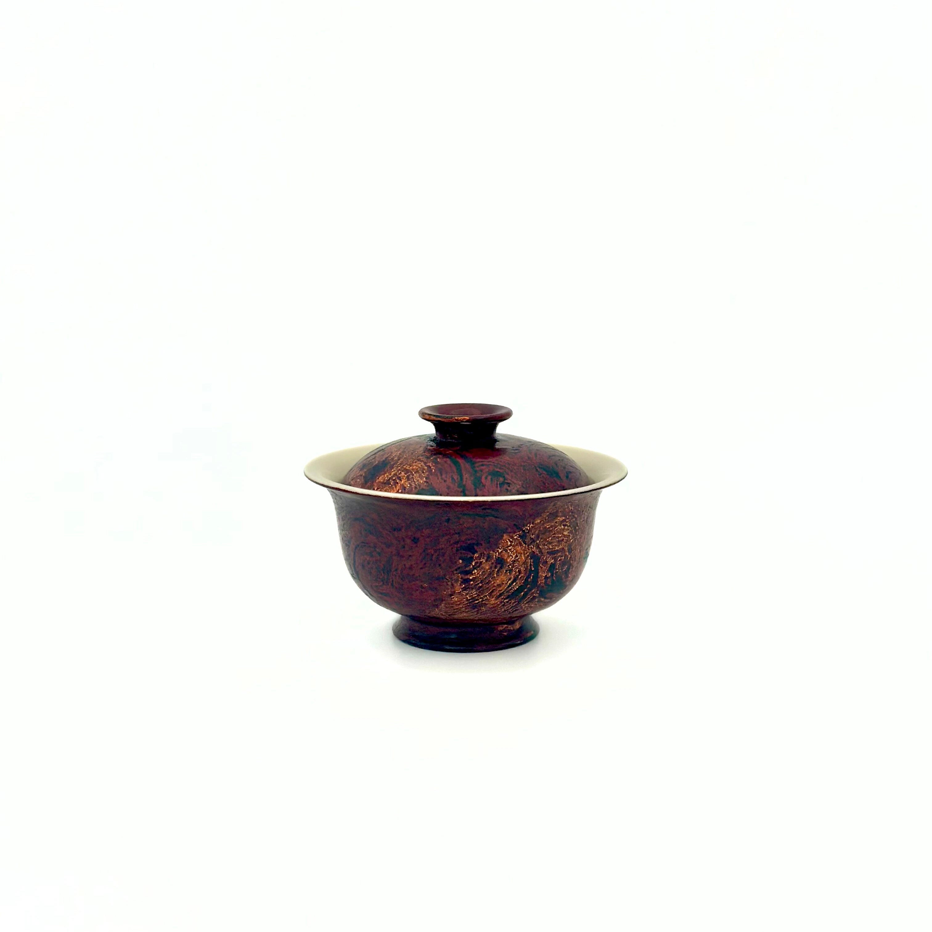 High angle shot showing the fitted lid and porcelain rim of the Crimson Eclipse small gaiwan.