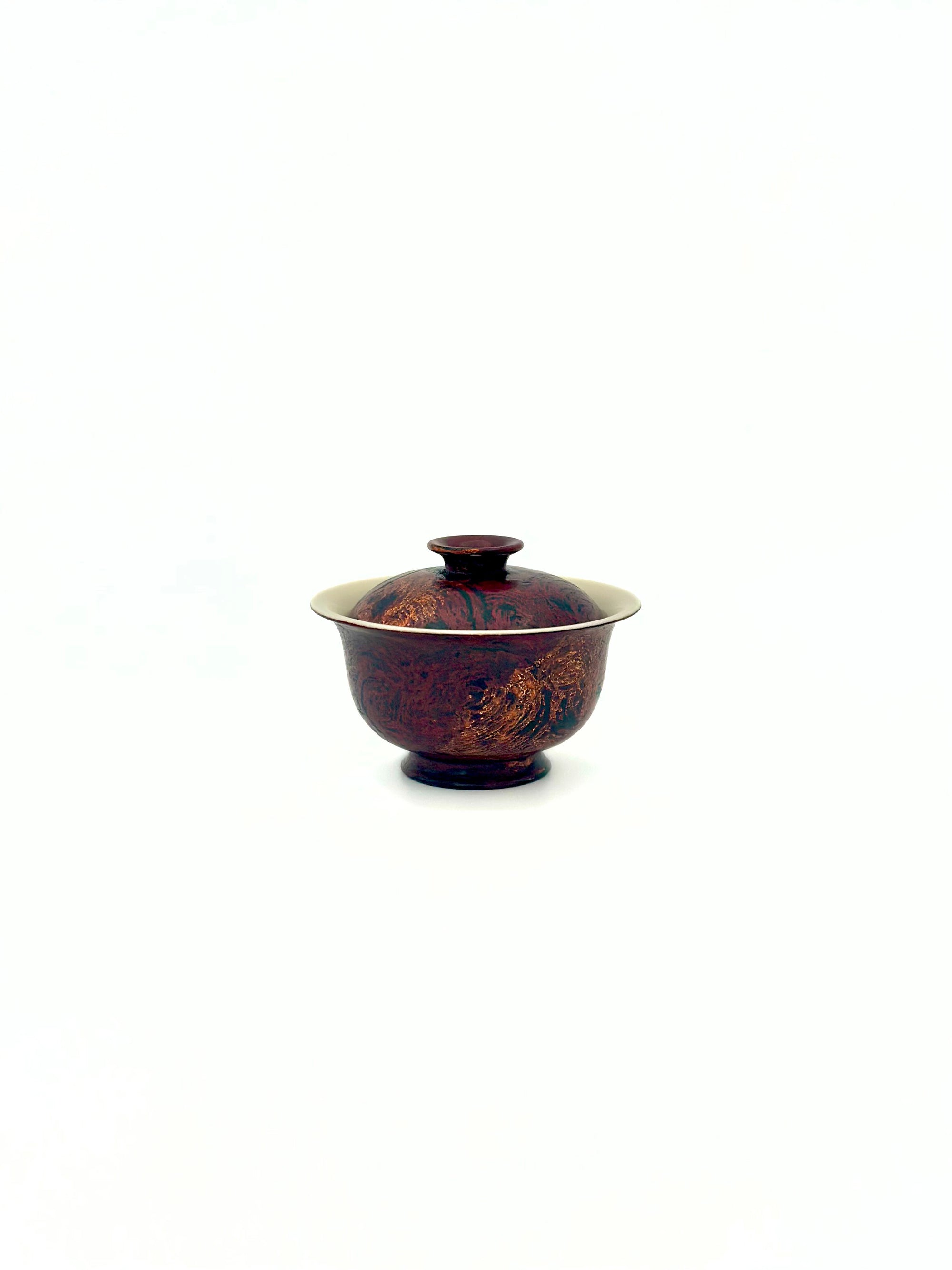High angle shot showing the fitted lid and porcelain rim of the Crimson Eclipse small gaiwan.