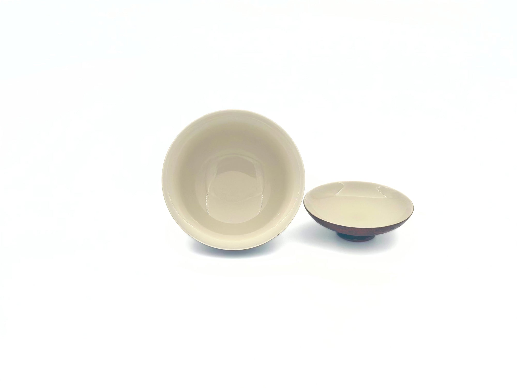 Open lid view showcasing the white porcelain interior glaze of the Crimson Eclipse tea vessel.