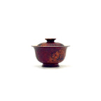 Ceramic teapot with lid on a white background
