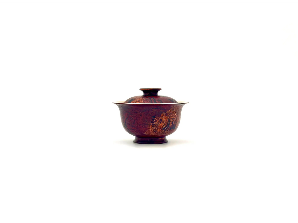 Front view of Crimson Eclipse 60ml solo gaiwan featuring dark red lacquer with gold brush strokes.