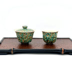 Complete Gongfu tea setup: Aurora Shore Gaiwan and master cup placed on a serving tray, ready for brewing loose leaf tea. Highlights the artisanal texture against a bamboo weaving tea tray.