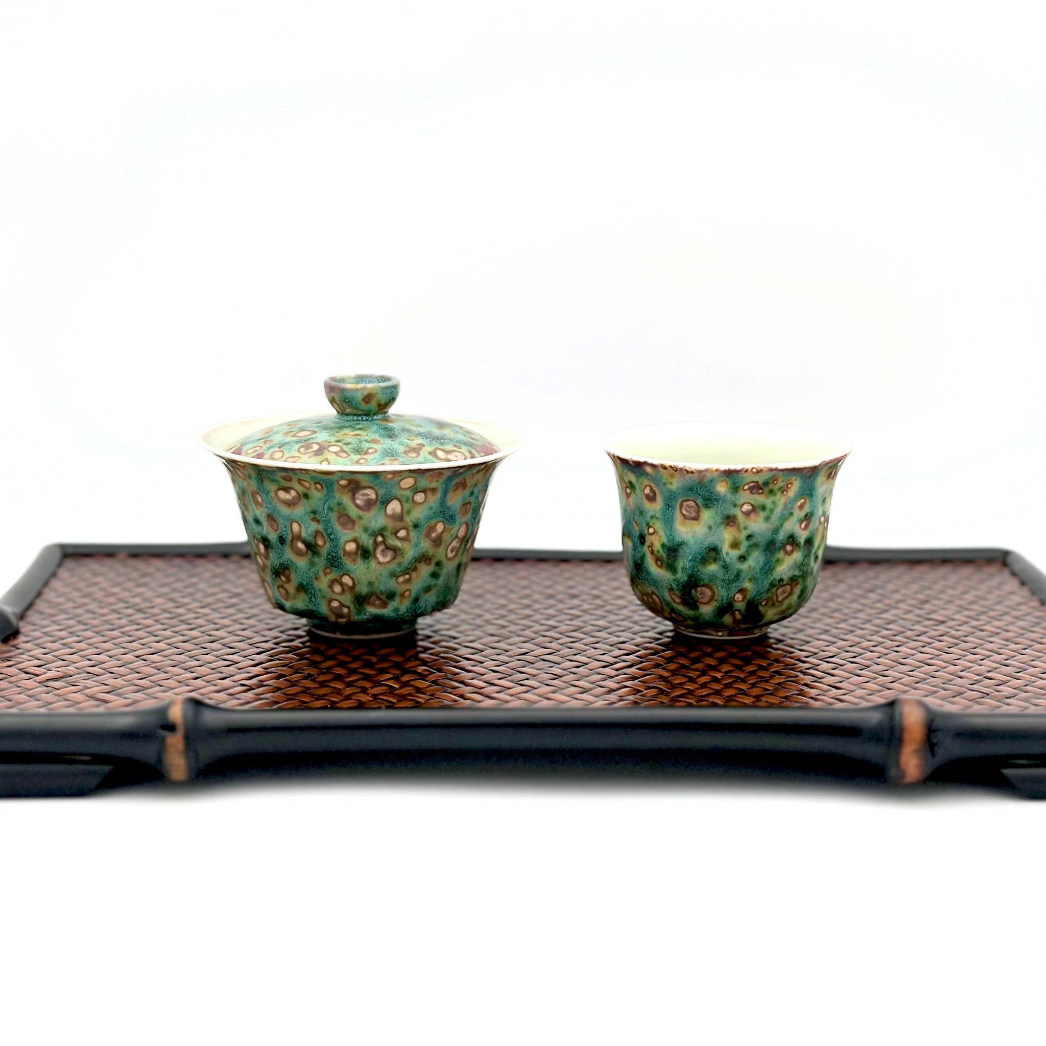 Complete Gongfu tea setup: Aurora Shore Gaiwan and master cup placed on a serving tray, ready for brewing loose leaf tea. Highlights the artisanal texture against a bamboo weaving tea tray.