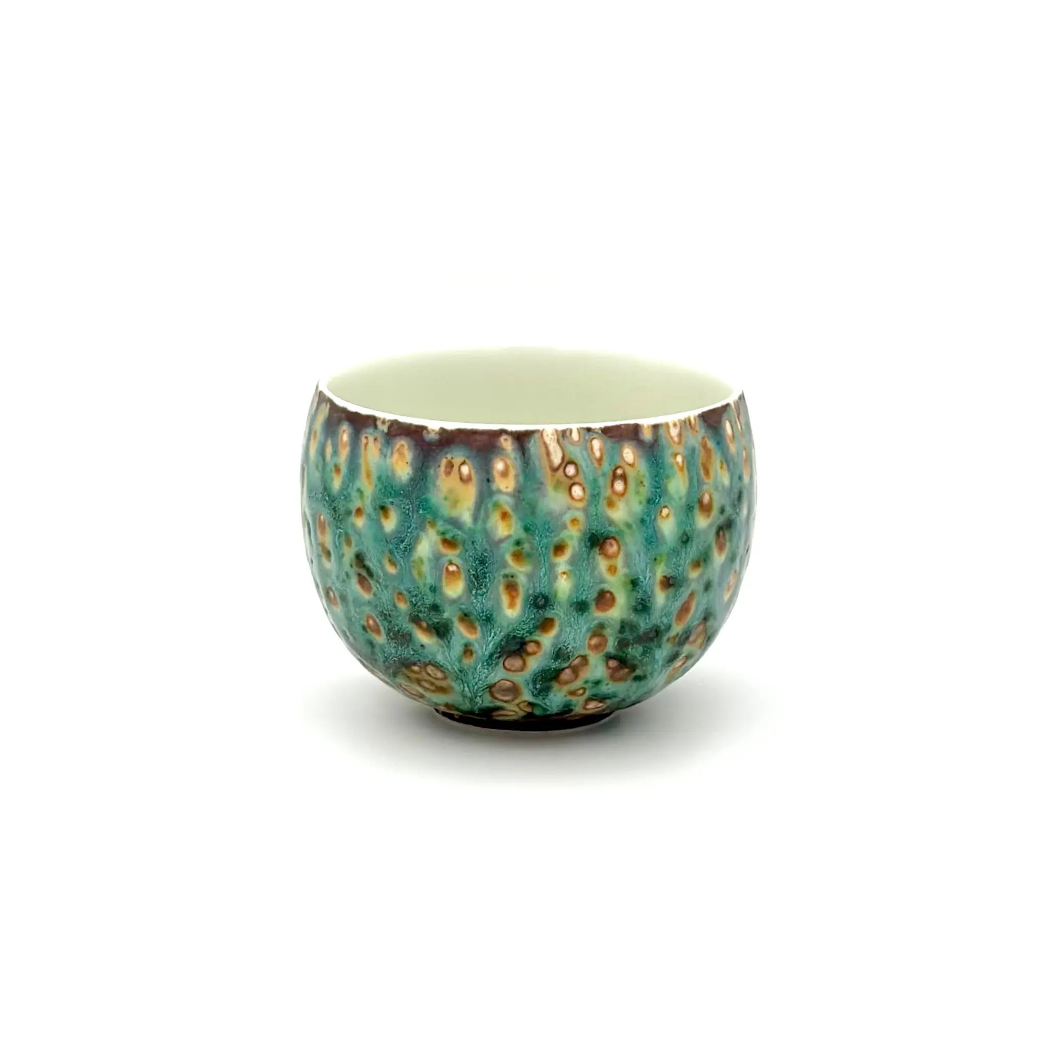 Angled front view of the Glazara Aurora Shore matcha latte cup, revealing the smooth interior wall designed for effortless whisking, paired with a stunning exterior glaze reminiscent of an ocean dawn.