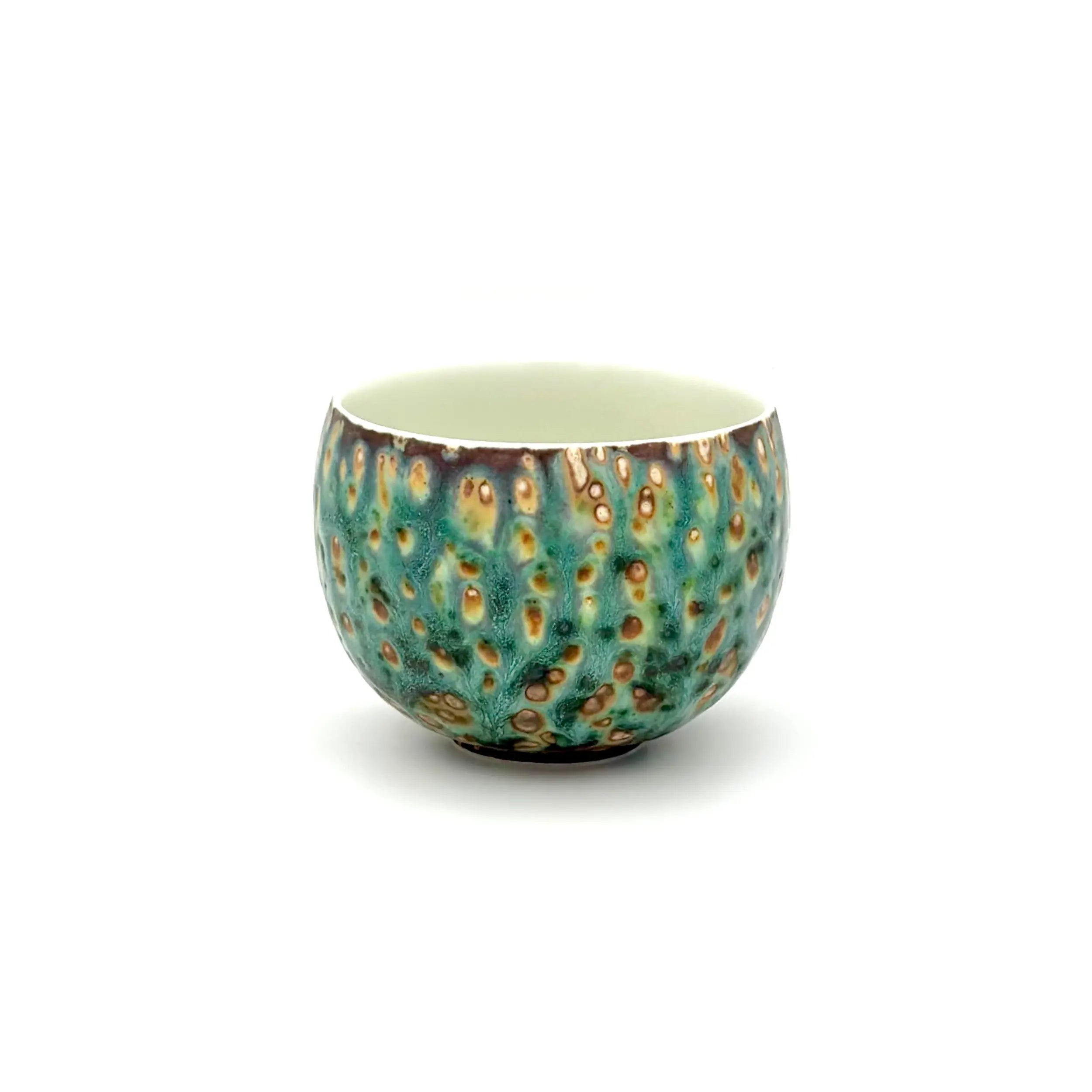 Angled front view of the Glazara Aurora Shore matcha latte cup, revealing the smooth interior wall designed for effortless whisking, paired with a stunning exterior glaze reminiscent of an ocean dawn.