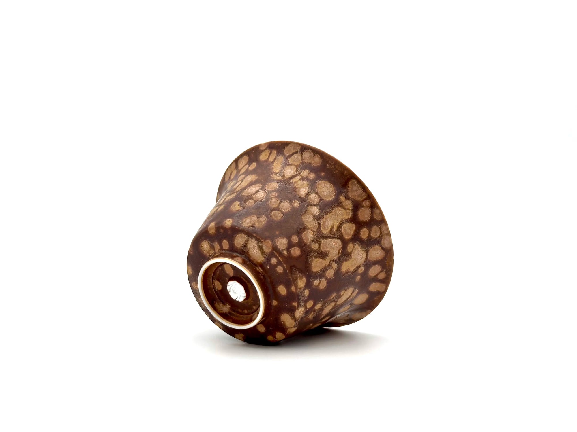 Macro detail of the Earthstone Drift Gaiwan base. Highlights the tactile texture of the glaze and the Glazara maker's stamp near the unglazed foot ring.