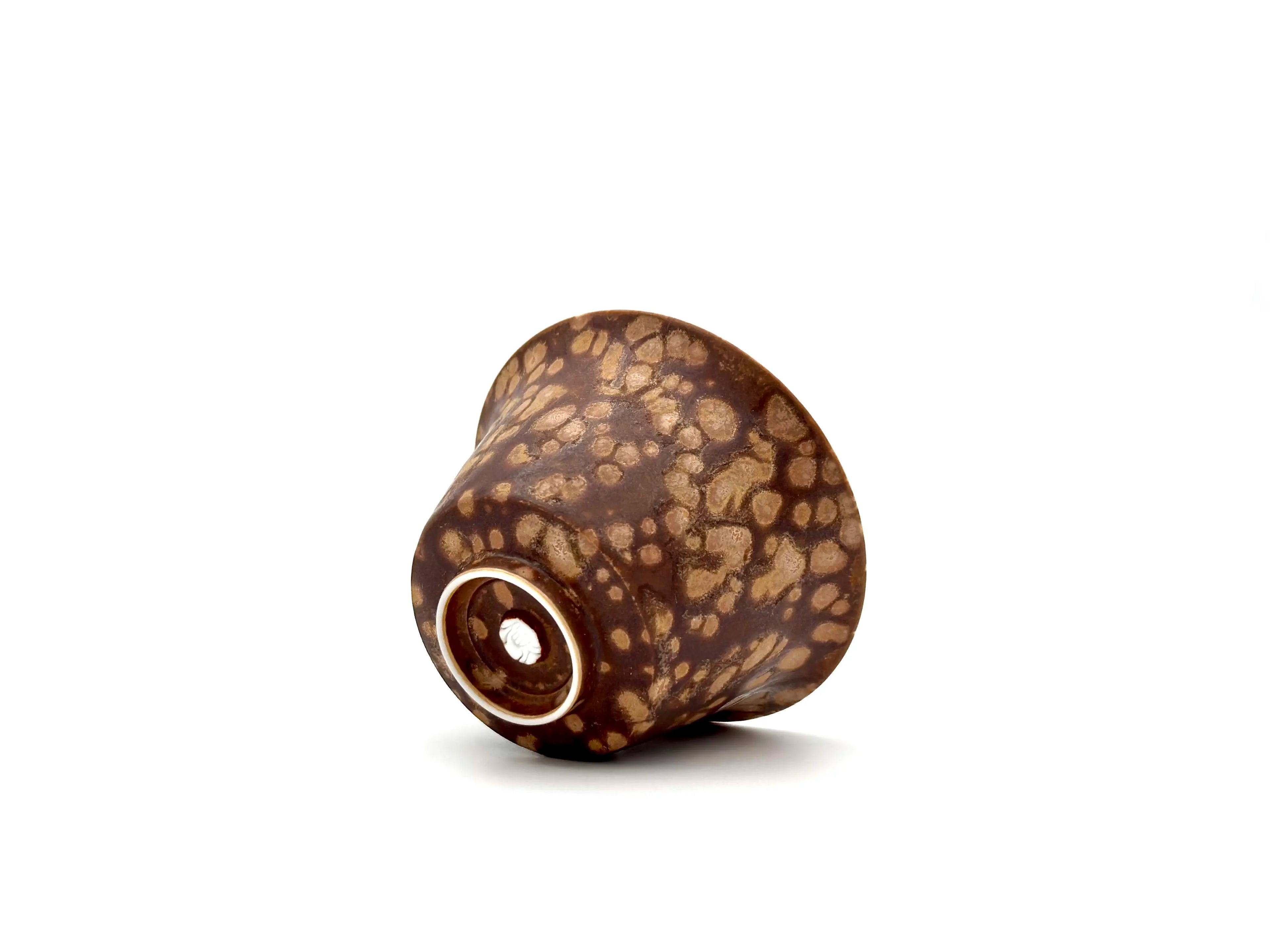 Macro detail of the Earthstone Drift Gaiwan base. Highlights the tactile texture of the glaze and the Glazara maker's stamp near the unglazed foot ring.