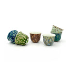 Glazara Elemental teacup group featuring artisan color gradients. Front view of ceramic tea cup sets showcasing the unique glaze finish of the Elemental collection.