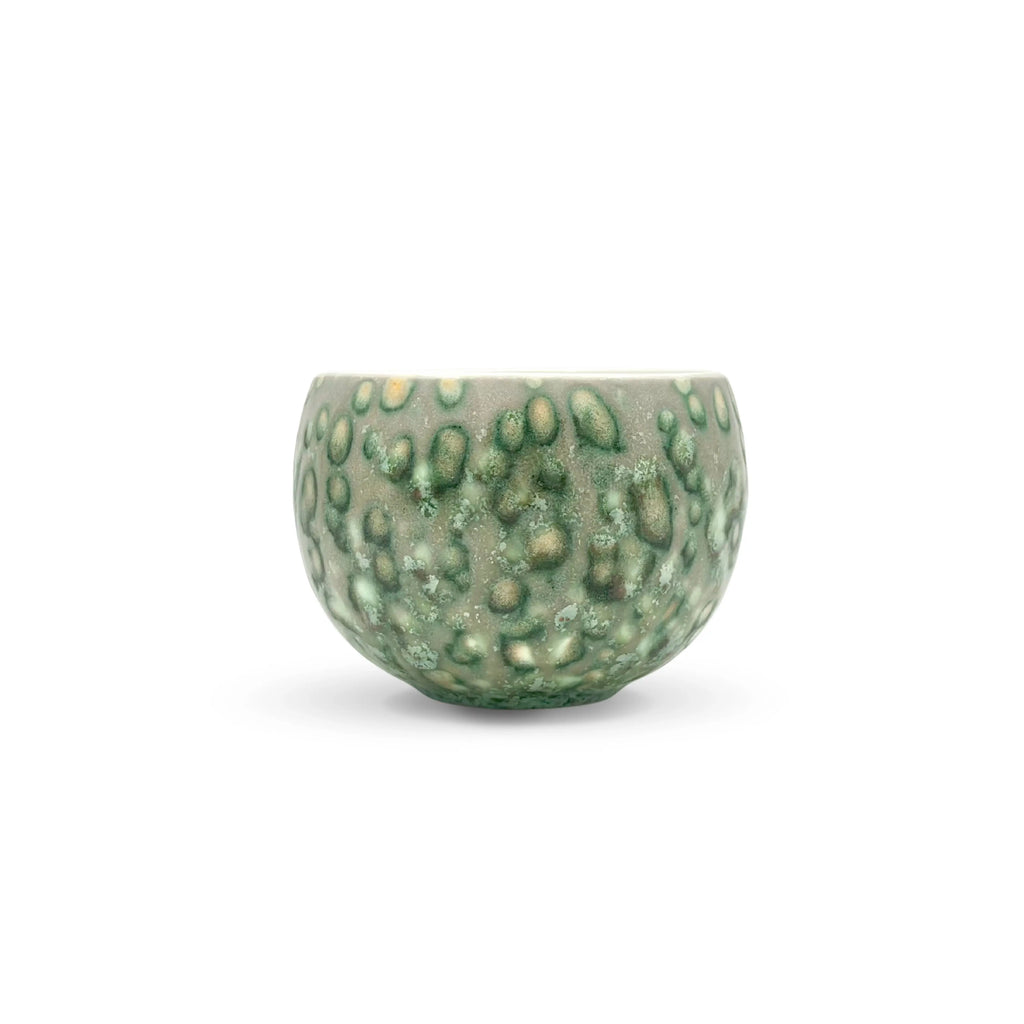 Straight-on profile view of the Glazara Emerald Current Matcha Latte Cup. Displays the fluid, cascading glaze patterns that mimic flowing water, featuring varying shades of deep forest and vibrant emerald green.