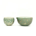 Front view of the artisan Glazara Emerald Drift Matcha Bowl displayed beautifully next to the matching latte cup, creating a stunning, coordinated matcha set perfect for daily rituals or as an elegant gift.