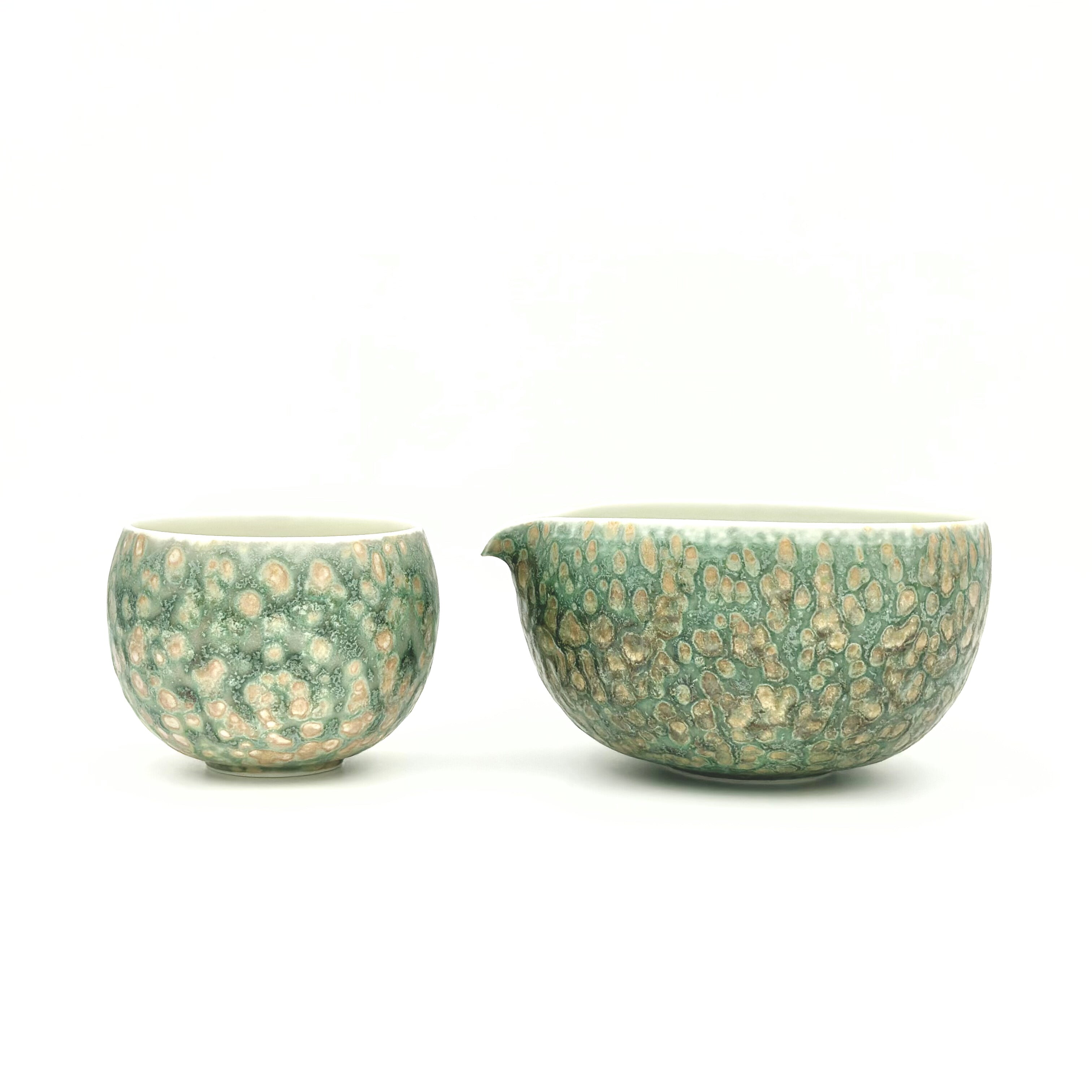 Front view of the artisan Glazara Emerald Drift Matcha Bowl displayed beautifully next to the matching latte cup, creating a stunning, coordinated matcha set perfect for daily rituals or as an elegant gift.