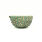 Front view of the hand-thrown Glazara Emerald Drift Matcha Bowl, showcasing its perfectly balanced chawan silhouette and the lush green, watercolor-like artisan glaze.