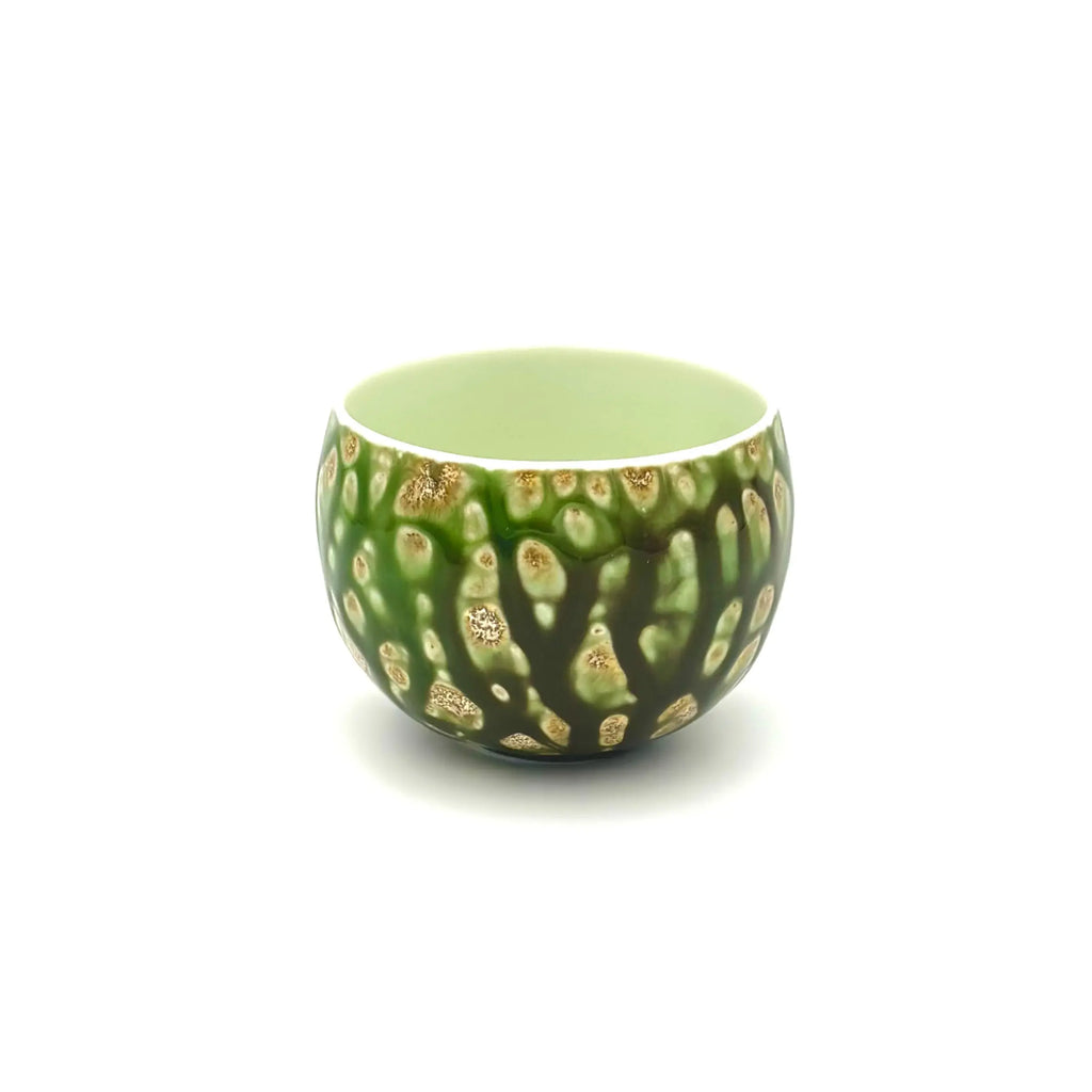 A high-angle front view of the Glazara Forest Echo Matcha Latte Cup, revealing the thickness of the rim and the contrasting glaze color on the inner wall.