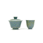A front-view tea set paring of Glazara Giverny Ripple solo gaiwan and tasting teacup, showcasing their matching aquatic, water-lily-inspired glazes.