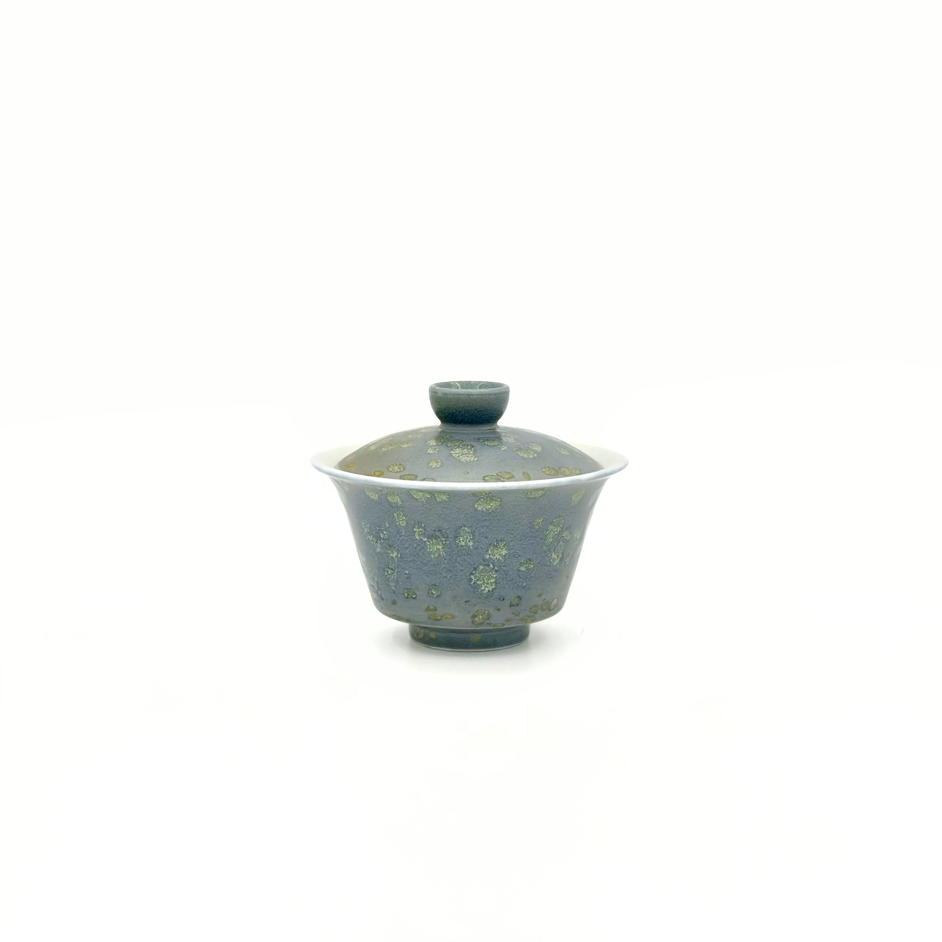 Angled front view of the Glazara Giverny Ripple 60ml Gongfu tea gaiwan, revealing the smooth white inner wall contrasting elegantly with the lush, garden-inspired exterior glaze.