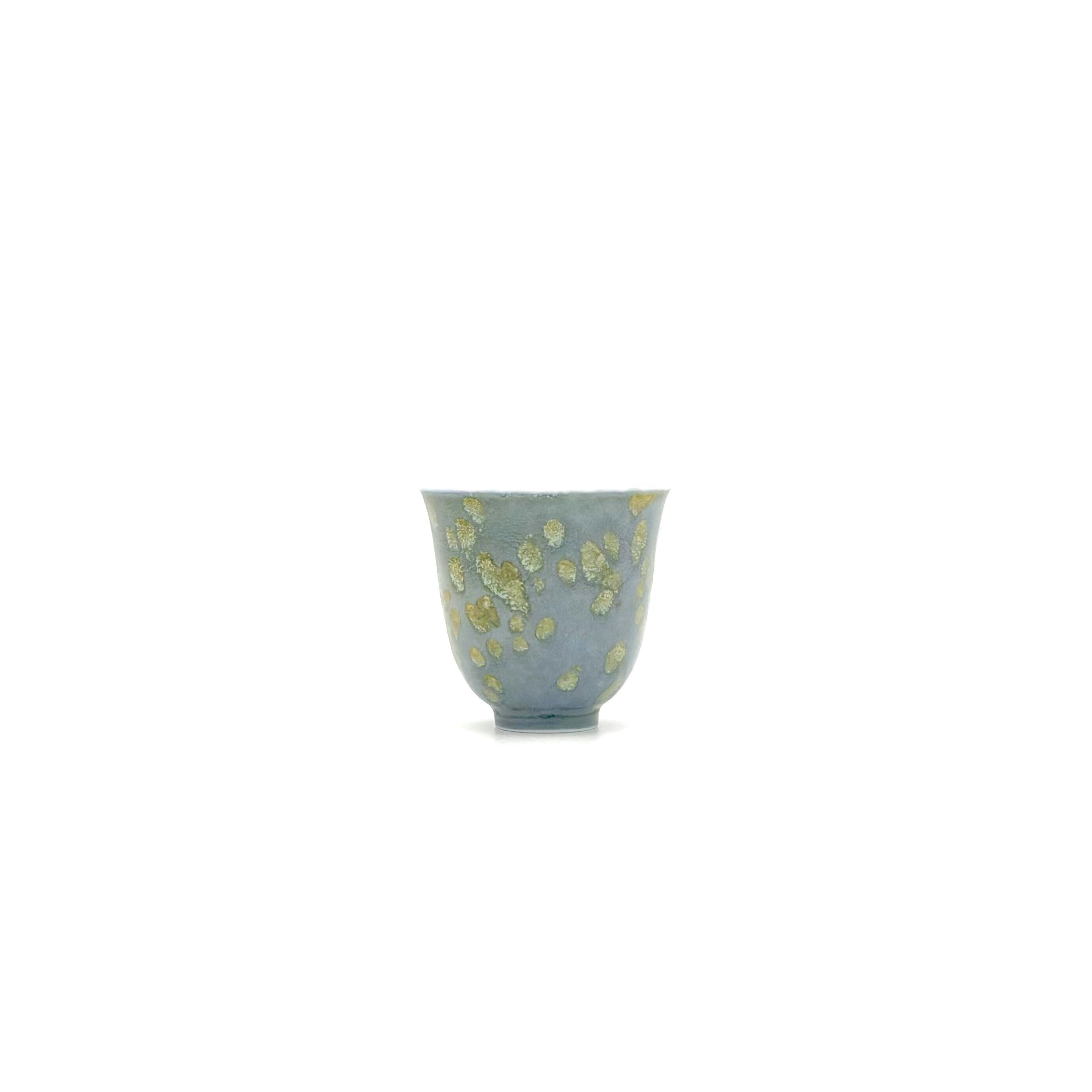 Front view of the 30ml Glazara Giverny Ripple porcelain teacup, featuring a fluid, aquatic glaze inspired by Monet's serene water lily gardens, designed for Gongfu tea rituals.