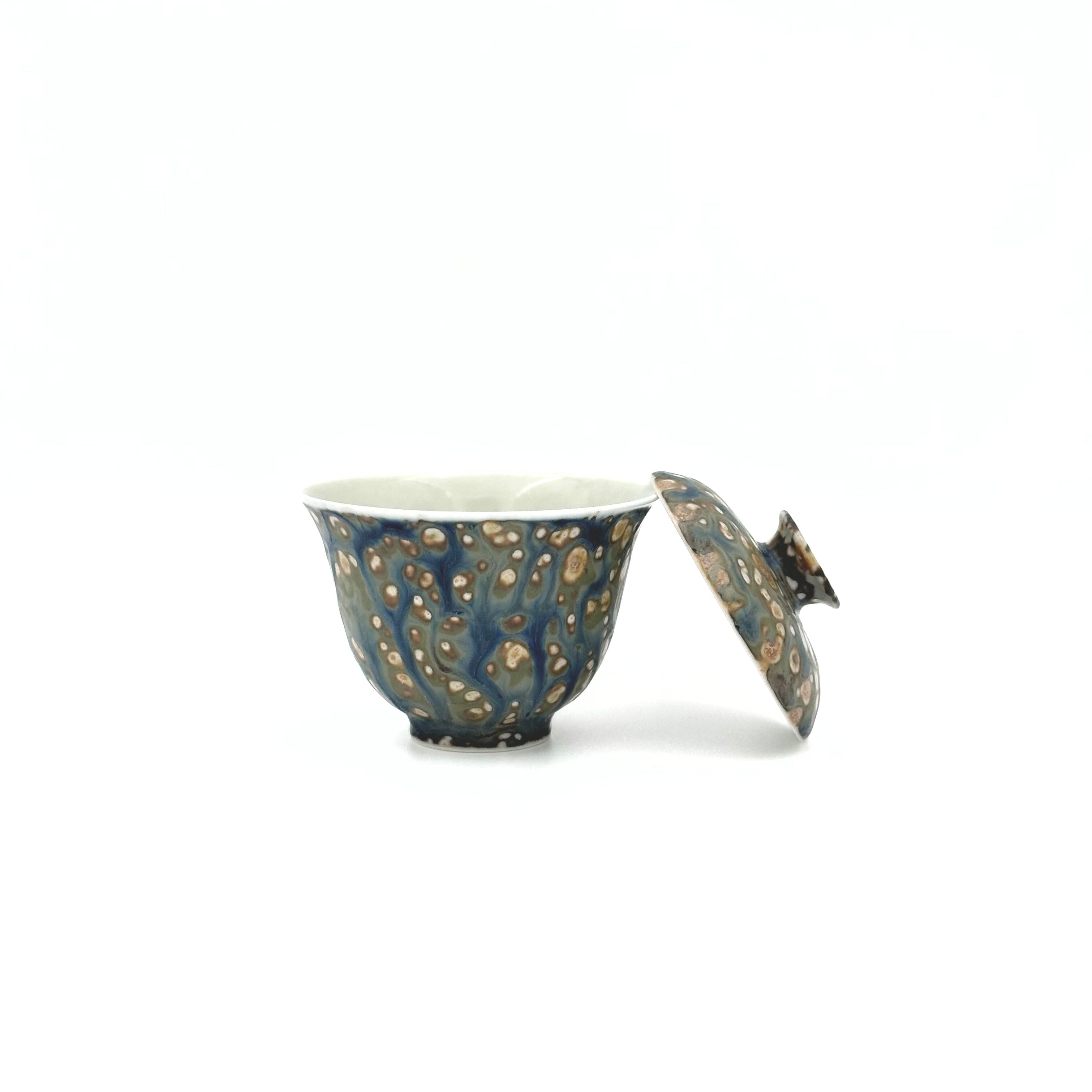 Front view of the Glazara Island Mist Elemental Porcelain Gaiwan with its lid elegantly resting on the edge, revealing the pristine inner wall and finely crafted rim details for Gongfu tea brewing.