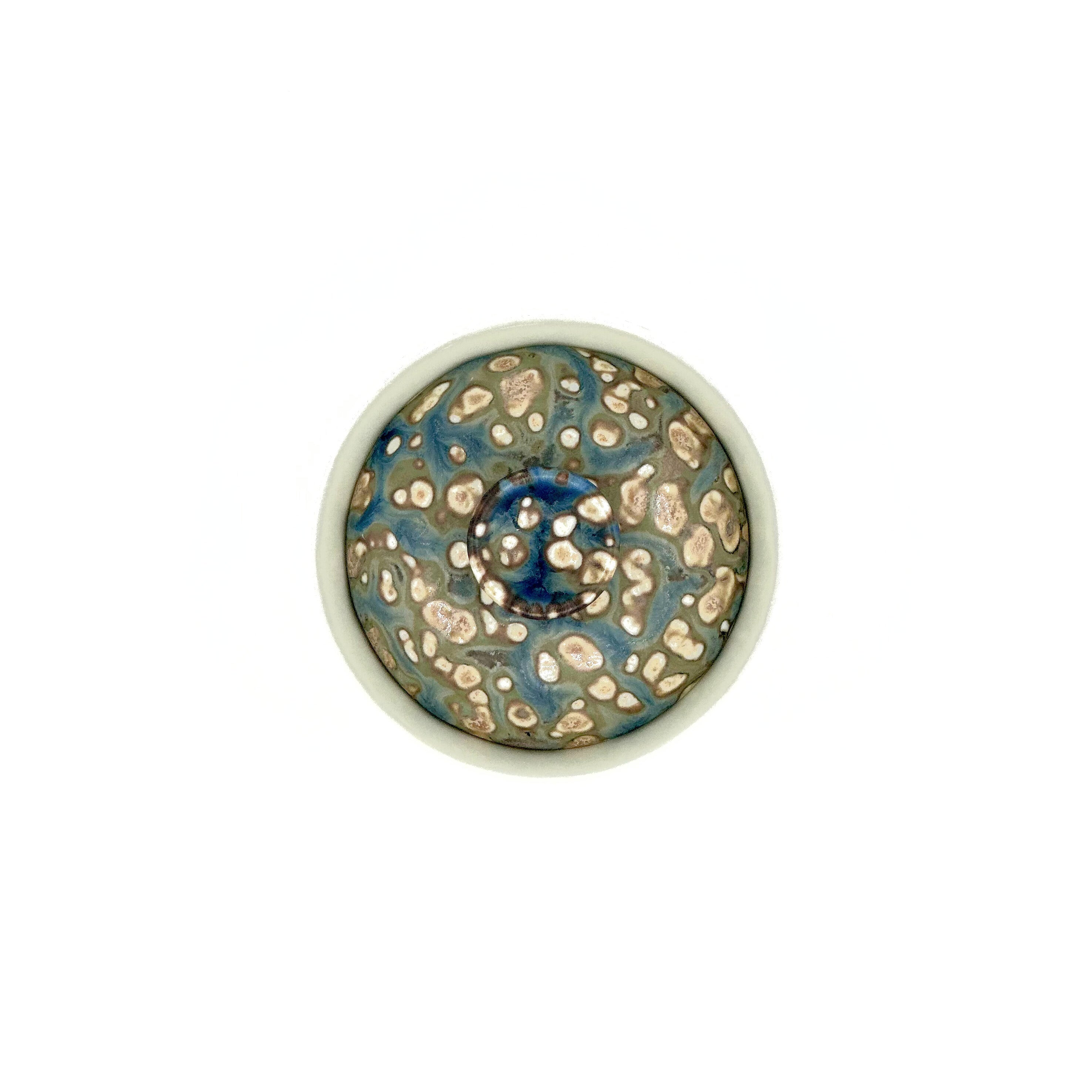 Overhead close-up of the 90ml Glazara Island Mist Elemental Porcelain Gaiwan, highlighting the precisely crafted lid, ergonomic knob, and subtle mist-inspired glaze details.