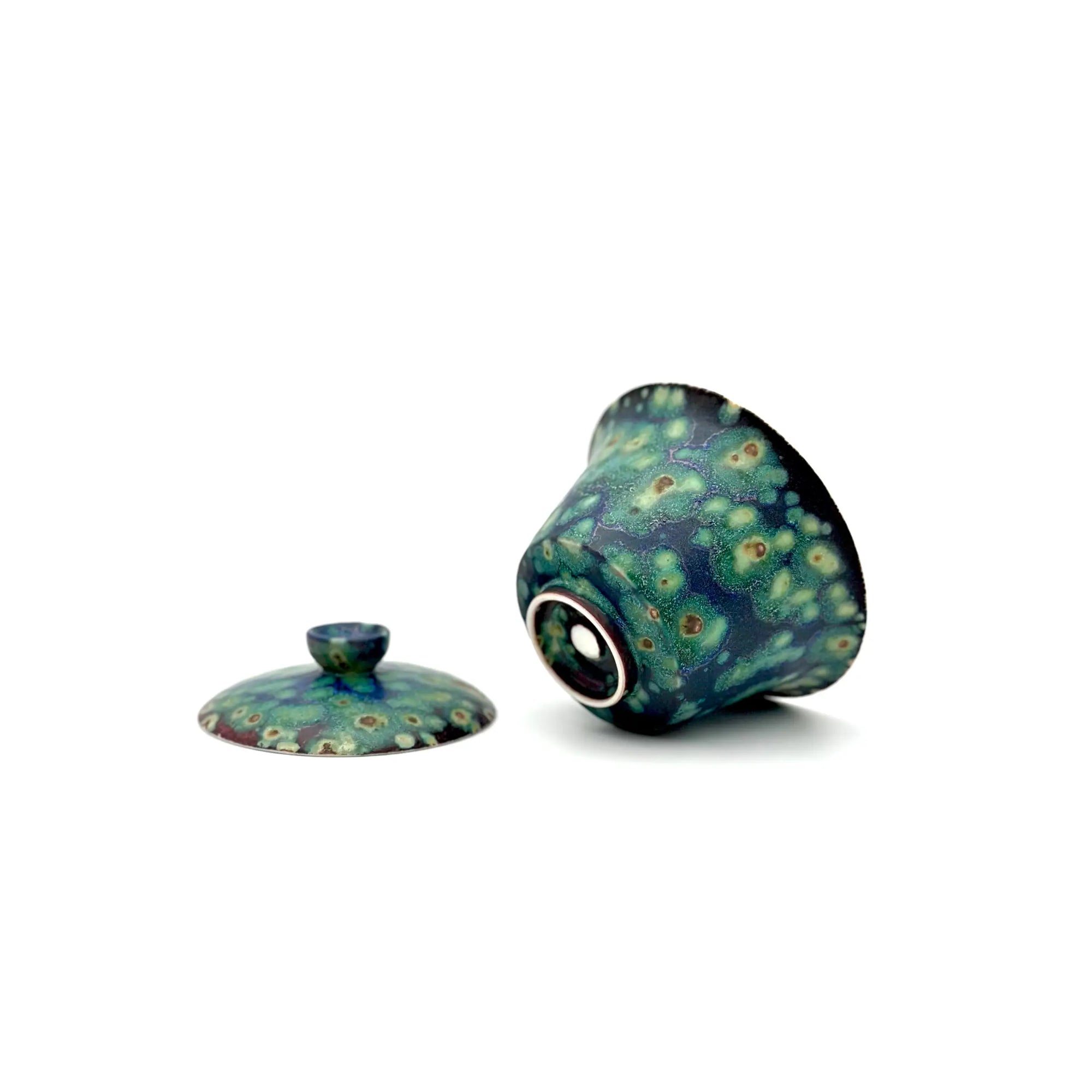 Underside of the Midsummer Night Gaiwan showing the unglazed foot ring and authentic Glazara aritsan's stamp. Highlights the clean trimming and the glaze transition at the base.