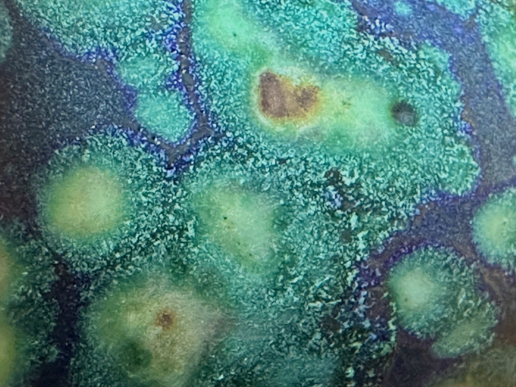 Macro close-up of the Midsummer Night glaze surface. Details the microscopic mineral variations and starry texture within the deep porcelain finish.