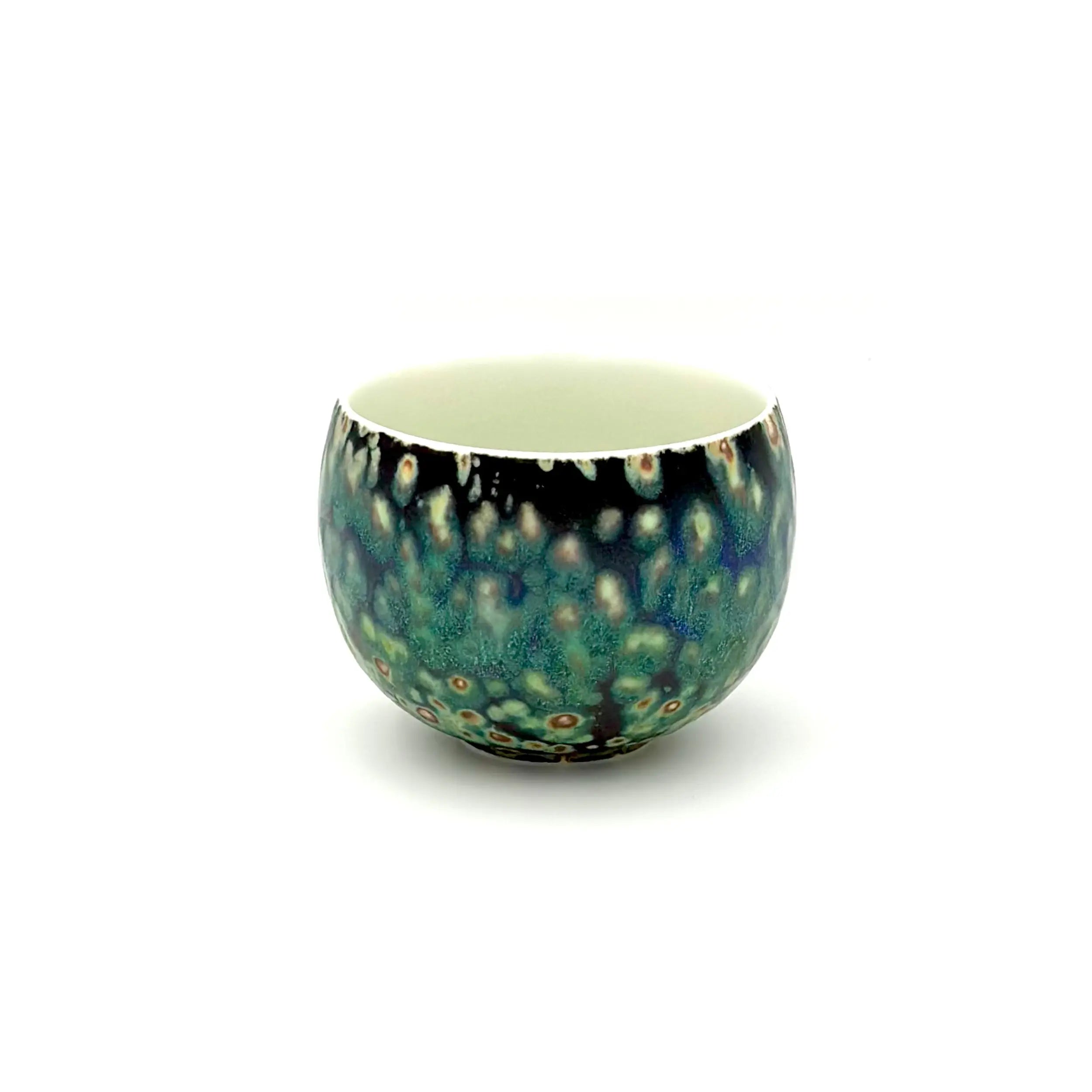 Angled front view of the Glazara Midsummer Night matcha latte cup, revealing the smooth interior wall and its elegant, dark exterior glaze reminiscent of a starry summer evening.