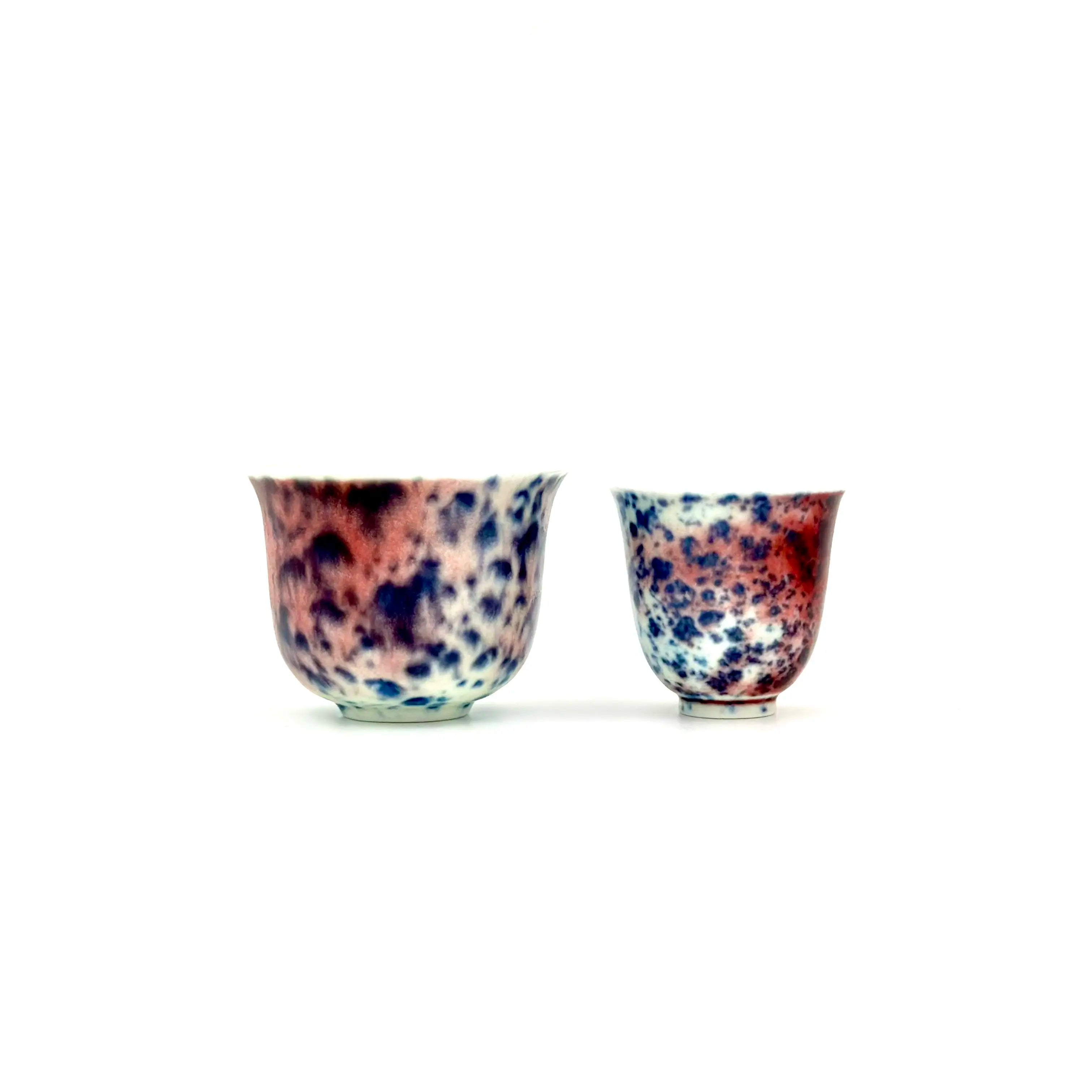 Front view shape comparison of the Glazara Montorgueil Gongfu teacups, showcasing the difference between the larger Master Teacup and the standard Tasting Teacup in their signature blue and red glaze.