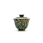 Porcelain gaiwan featuring a textured design on a white background
