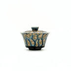 Porcelain gaiwan with a textured surface on a white background