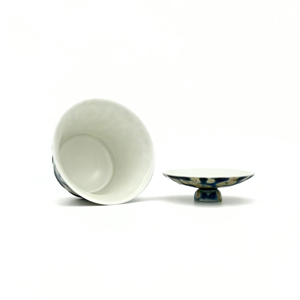 porcelain gaiwan and open lid stand on a white background