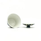 porcelain gaiwan and open lid stand on a white background