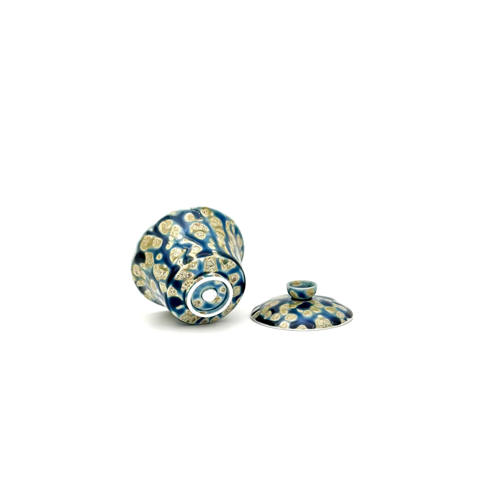 Functional and decorative porcelain gaiwan with blue and white floral pattern on a white background