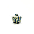 Ceramic gaiwan with lid featuring a blue and gold pattern on a white background