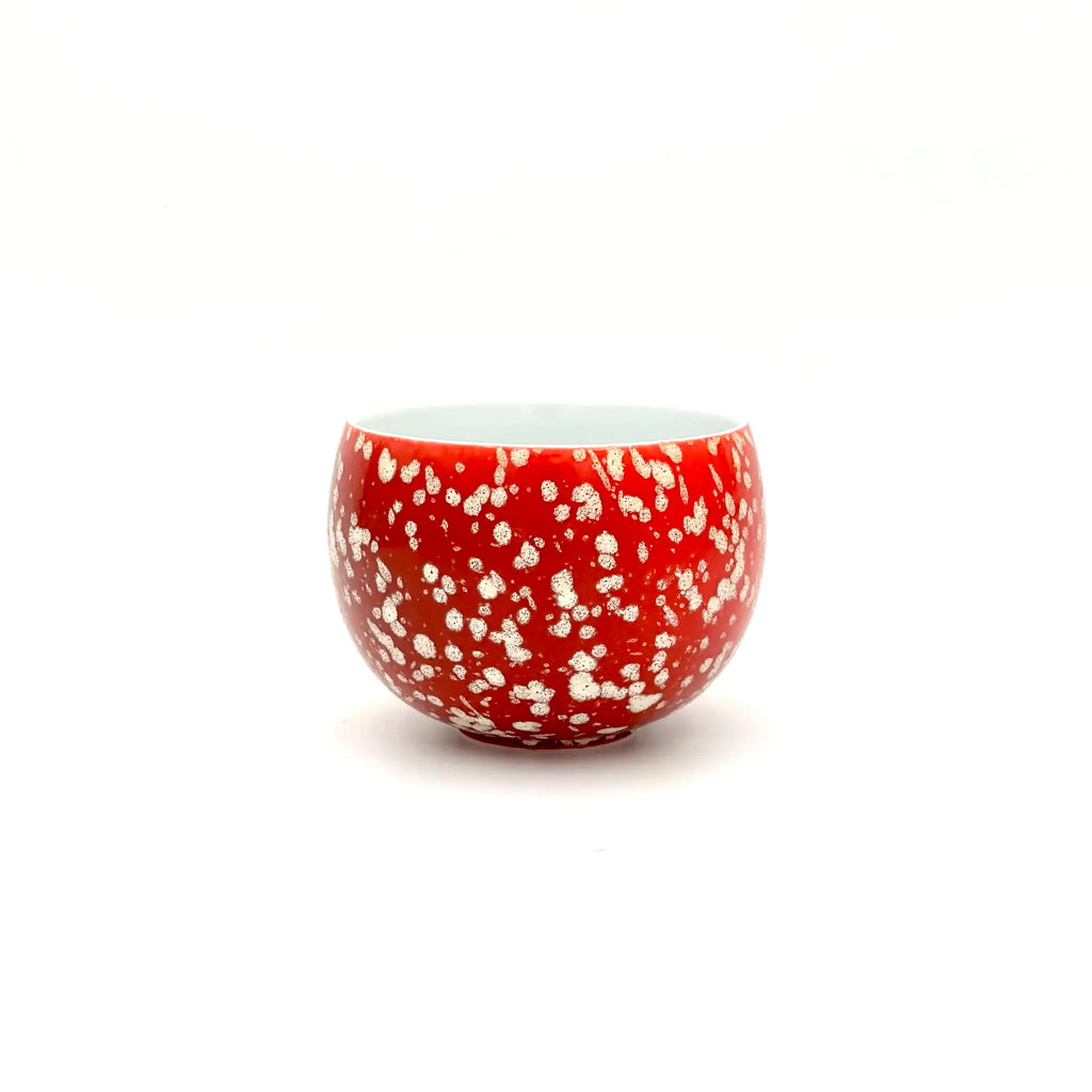 Angled front view of the Glazara Phoenix Spark matcha latte cup, revealing a smooth interior wall that contrasts beautifully with the dynamic, fiery exterior glaze.