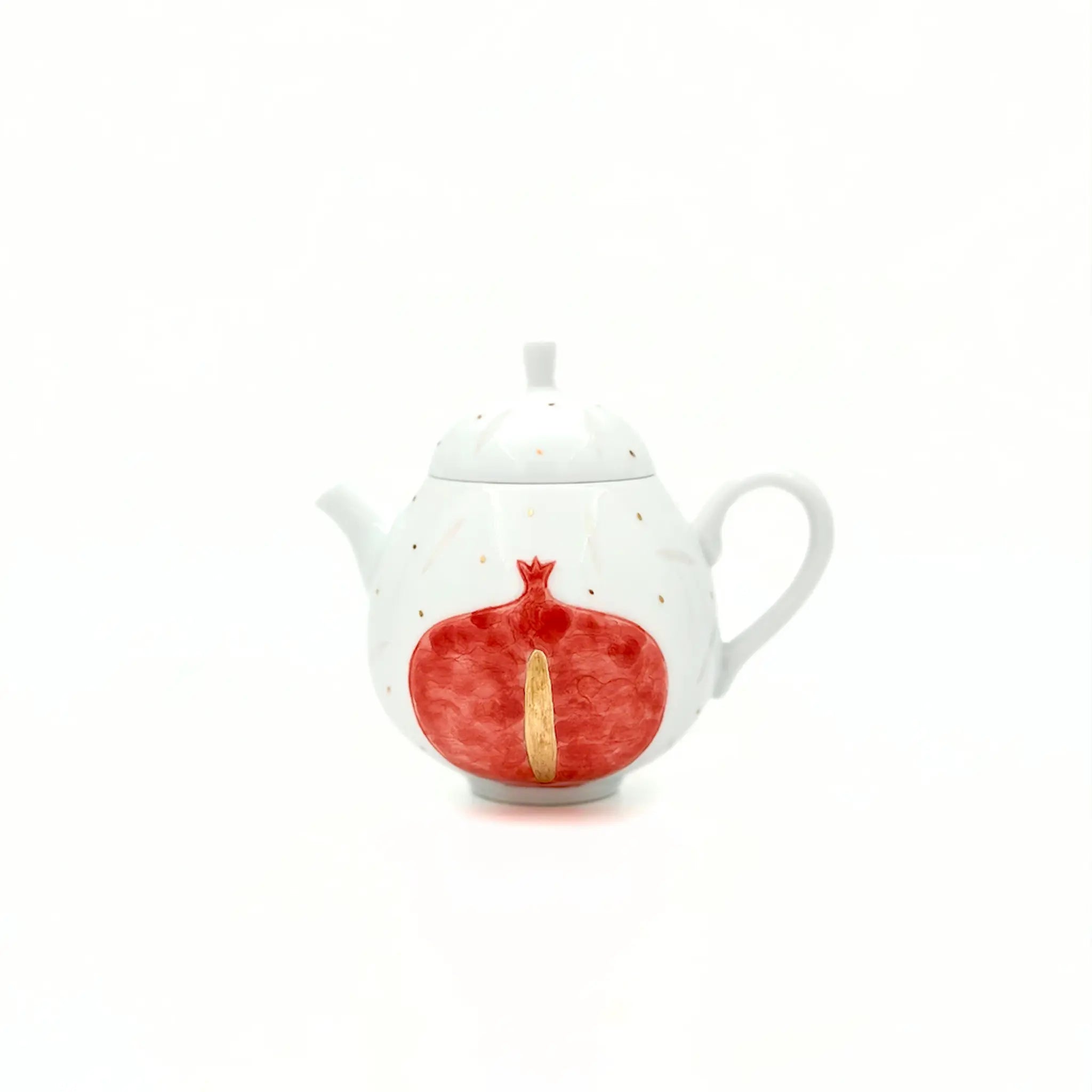 White teapot with a red pomegranate design on a white background