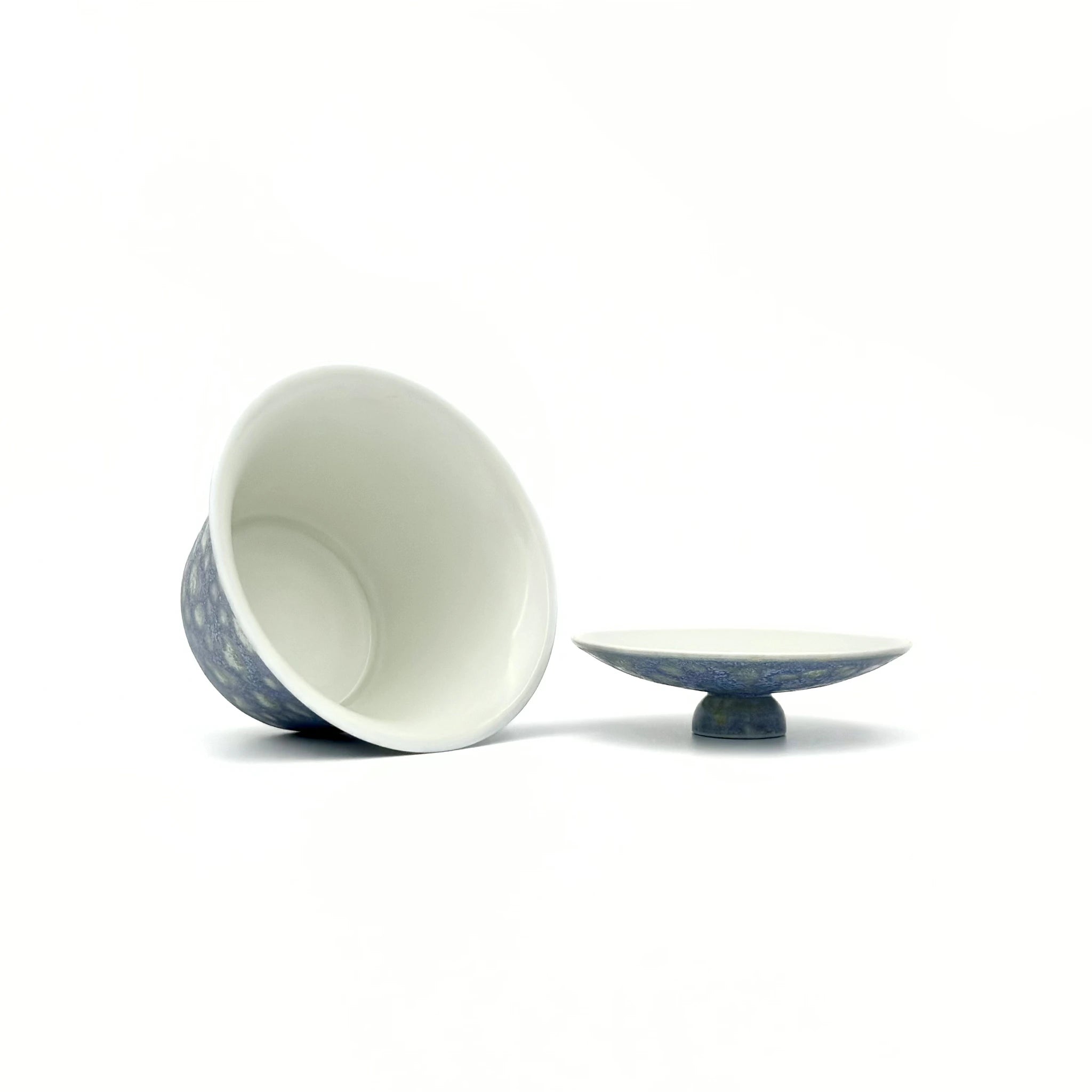 Ceramic gaiwan with blue patterns on a white background