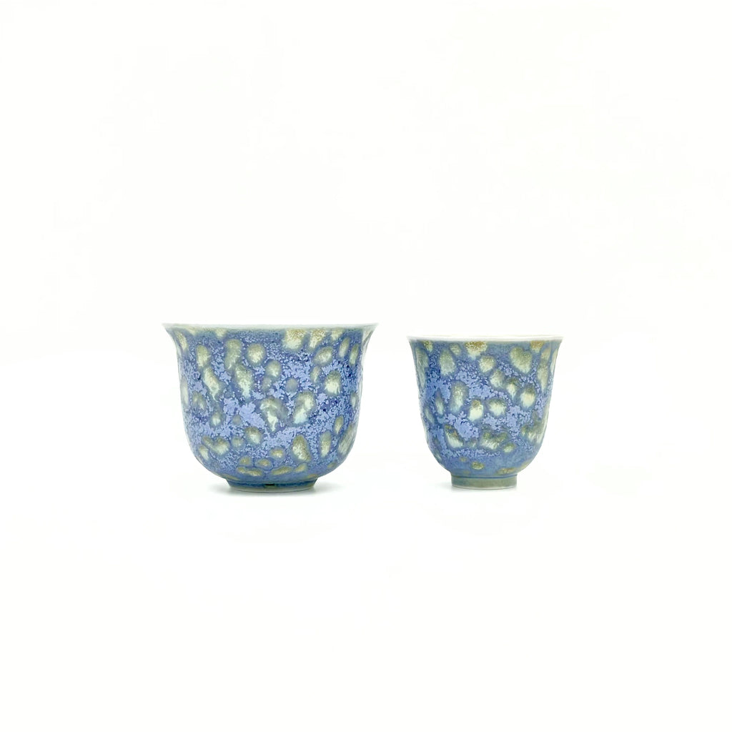 Front view comparing the sizes and shapes of the Glazara Promenade Breeze Master Cup alongside a standard tasting cup, illustrating the distinctive scale and commanding presence of the host cup in a Gongfu tea set.