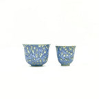 Front view comparing the sizes and shapes of the Glazara Promenade Breeze Master Cup alongside a standard tasting cup, illustrating the distinctive scale and commanding presence of the host cup in a Gongfu tea set.