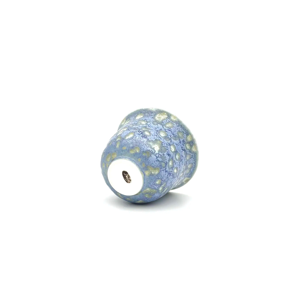 Highlight the bottom glaze and artisan's signature against a white background