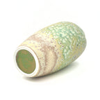 Cylindrical ceramic vase with textured surface on a white background