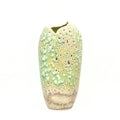 Handcrafted sage green porcelain artisan vase with crater glaze texture, front view.