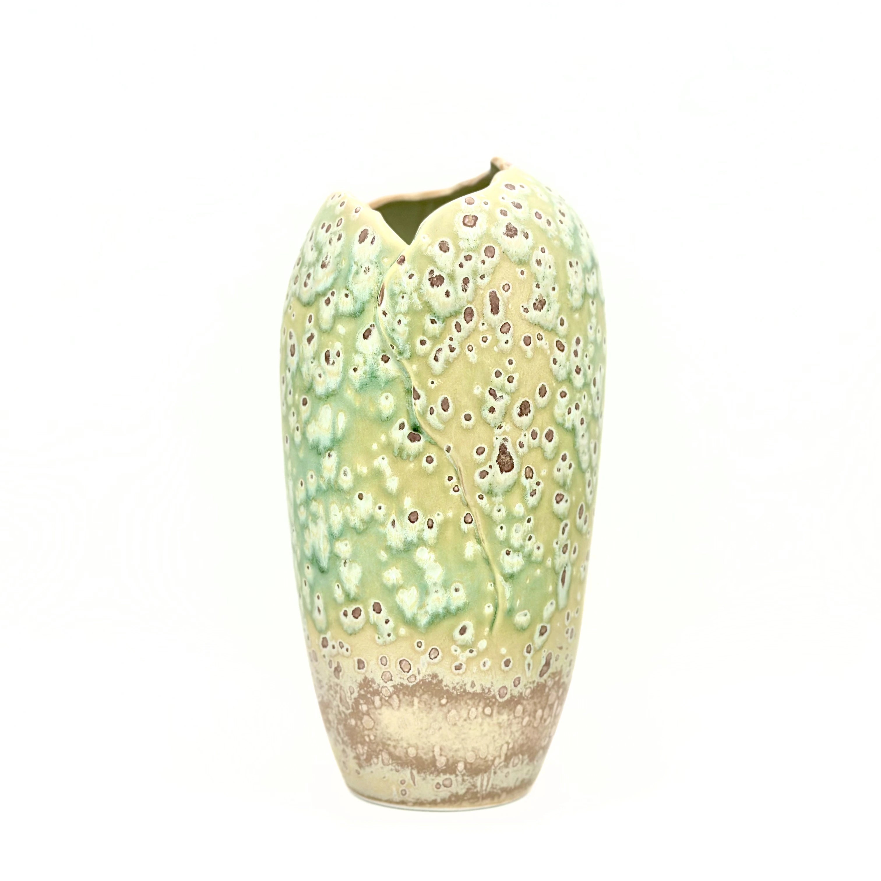 Handcrafted sage green porcelain artisan vase with crater glaze texture, front view.