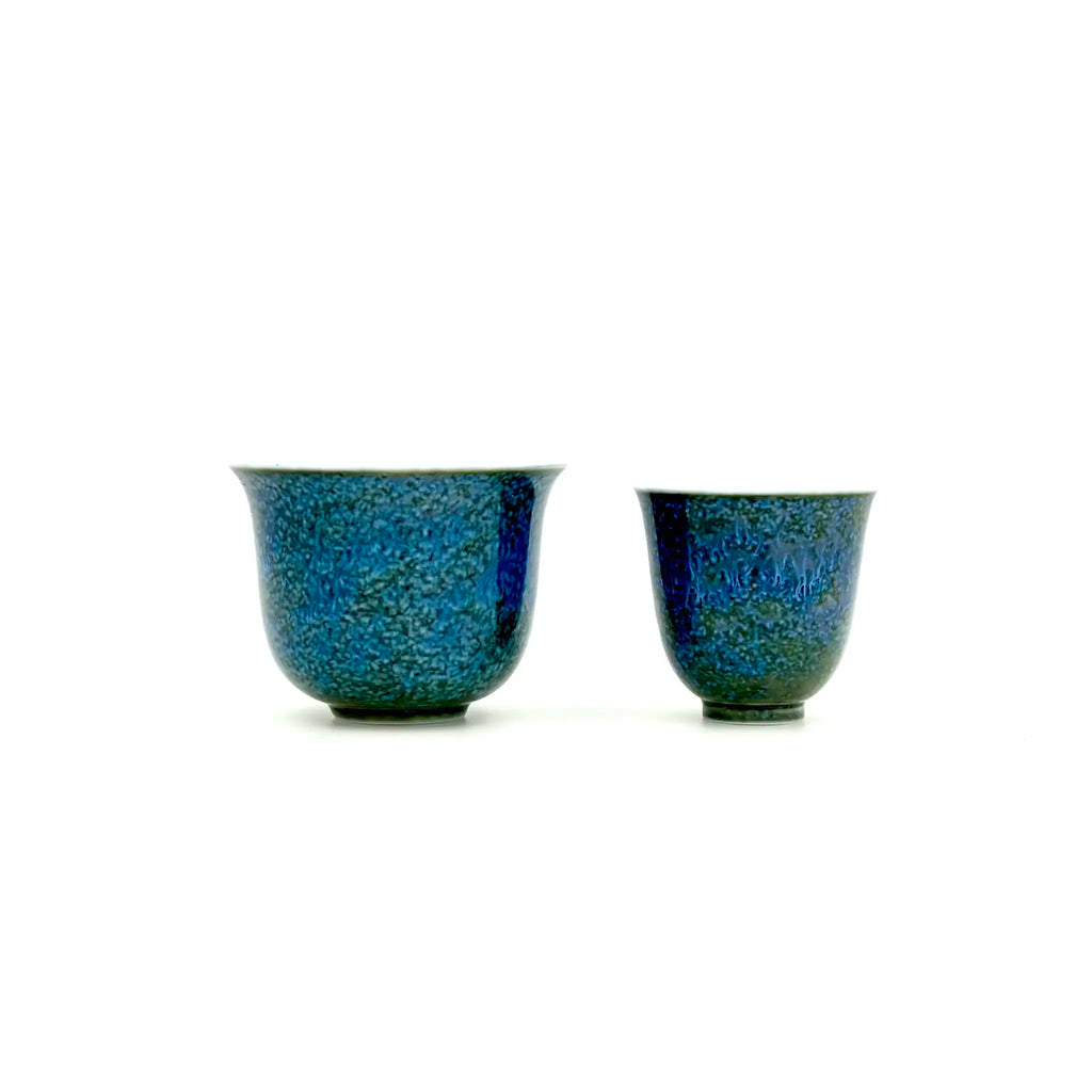 Front view comparing the size and shape of the larger Glazara Verdant Mirror host teacup next to the smaller 30ml tasting teacup.