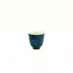 Front view of the 30ml Glazara Verdant Mirror tasting teacup, highlighting the carefully crafted inner rim and deep green exterior glaze.