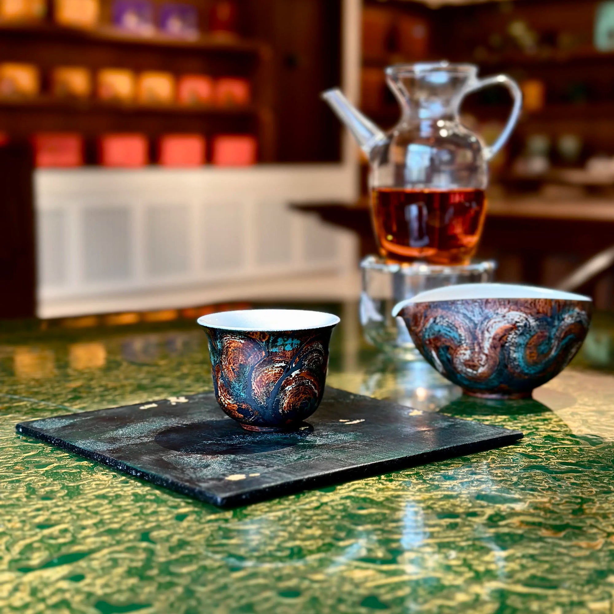 Lifestyle view of the Glazara Vintage Flora 70ml porcelain Gongfu teacup resting on a wood lacquer tray, bringing Eastern tea culture and artful living into modern homes.