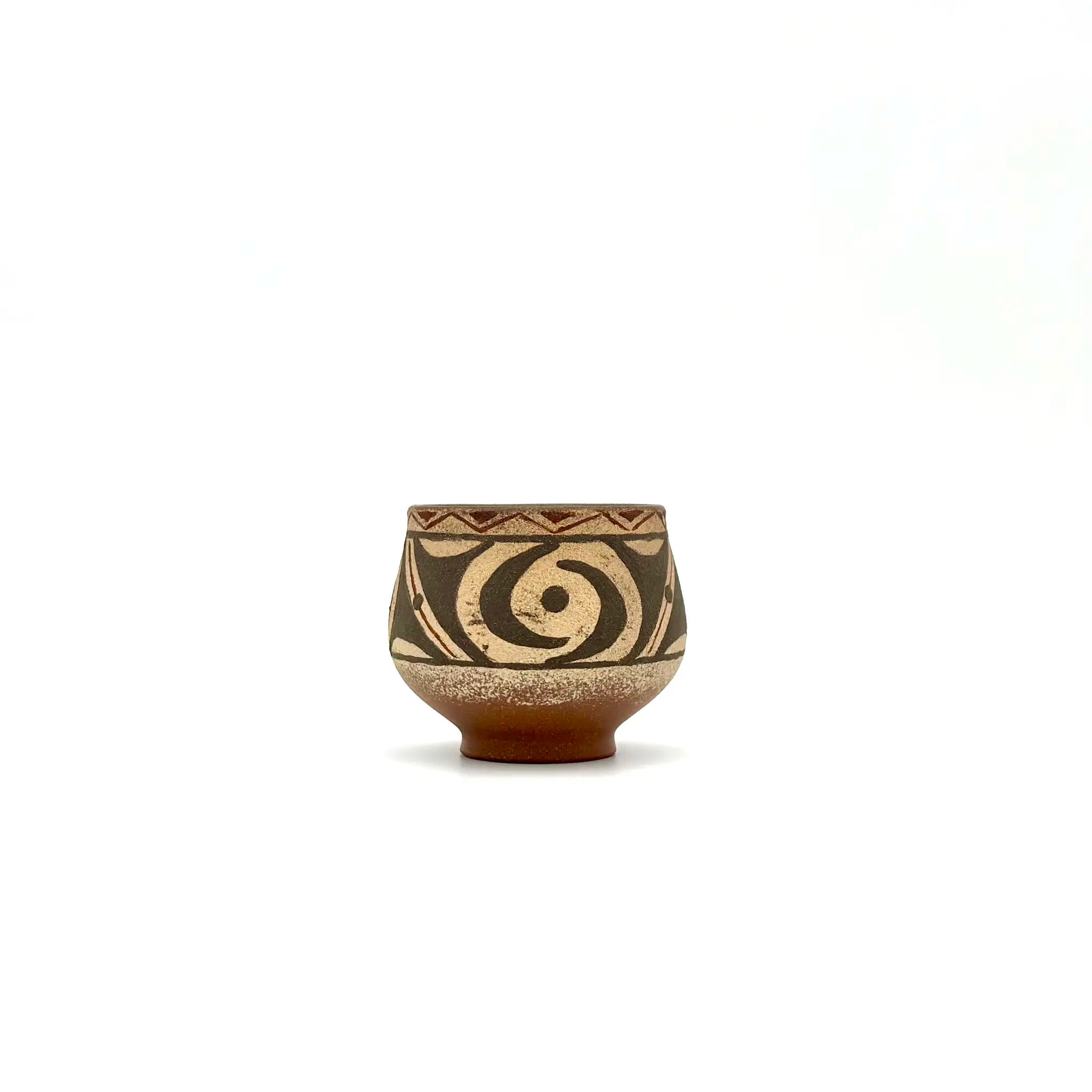 Front view of the 80ml Ivory Canvas white-slip painted Yixing Zisha teacup, showcasing the striking contrast of hand-painted Neolithic motifs against the pale clay.