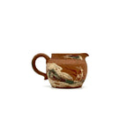Detailed front view of the Nine-Colored Deer Yixing Fairness Cup, featuring the classic and sacred hand-painted Dunhuang mythological deer imagery against the rustic clay.