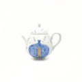 Ceramic teapot with blue pomegranate design on a white background
