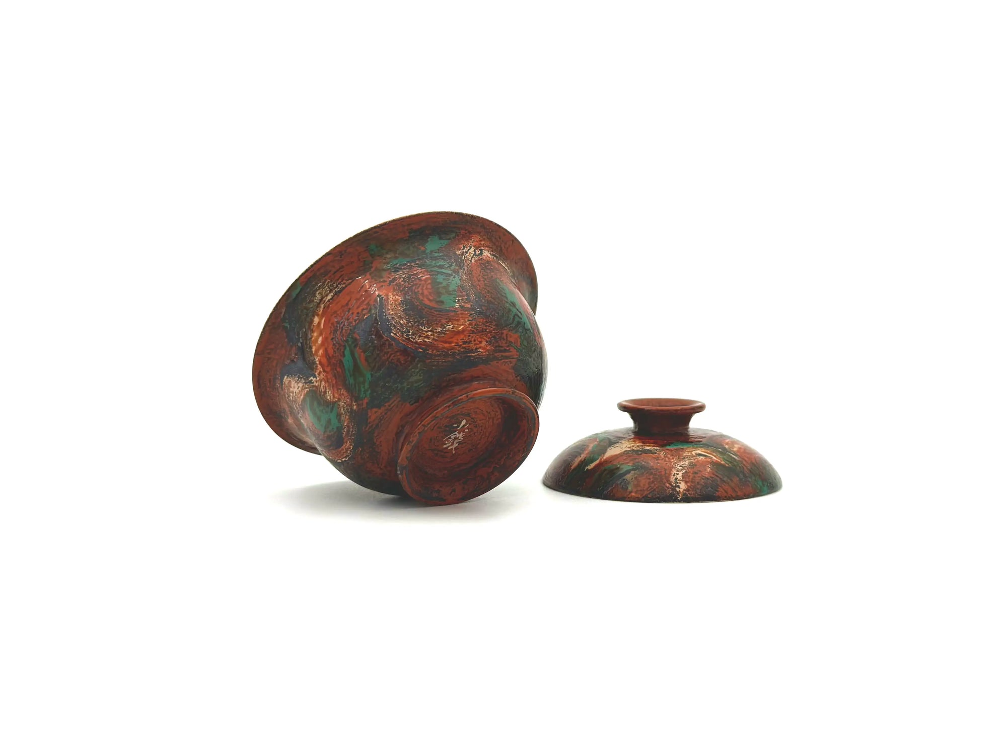 Underside of the Vintage Flora gaiwan showcasing the artist's mark and polished lacquer.