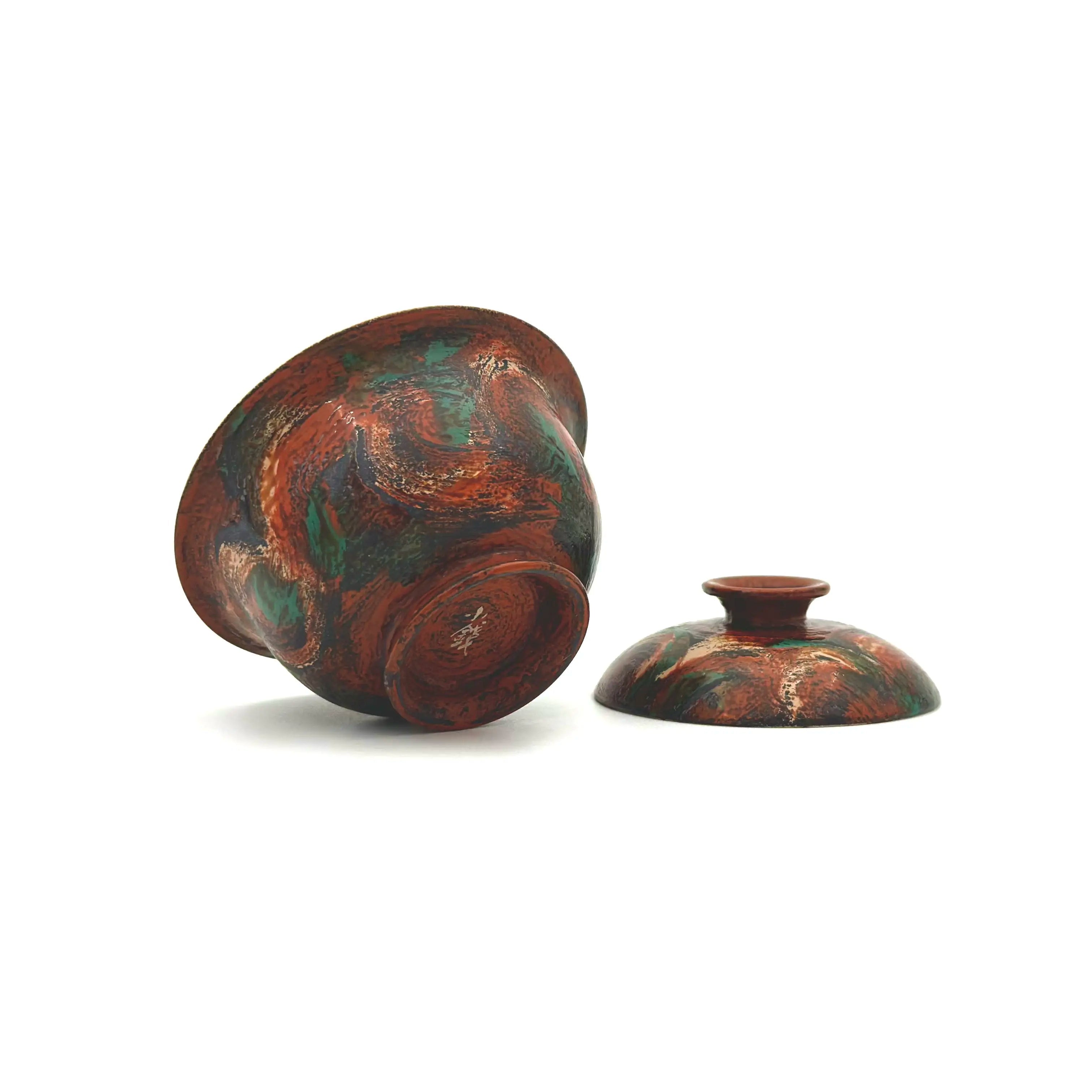 Underside of the Vintage Flora gaiwan showcasing the artist's mark and polished lacquer.